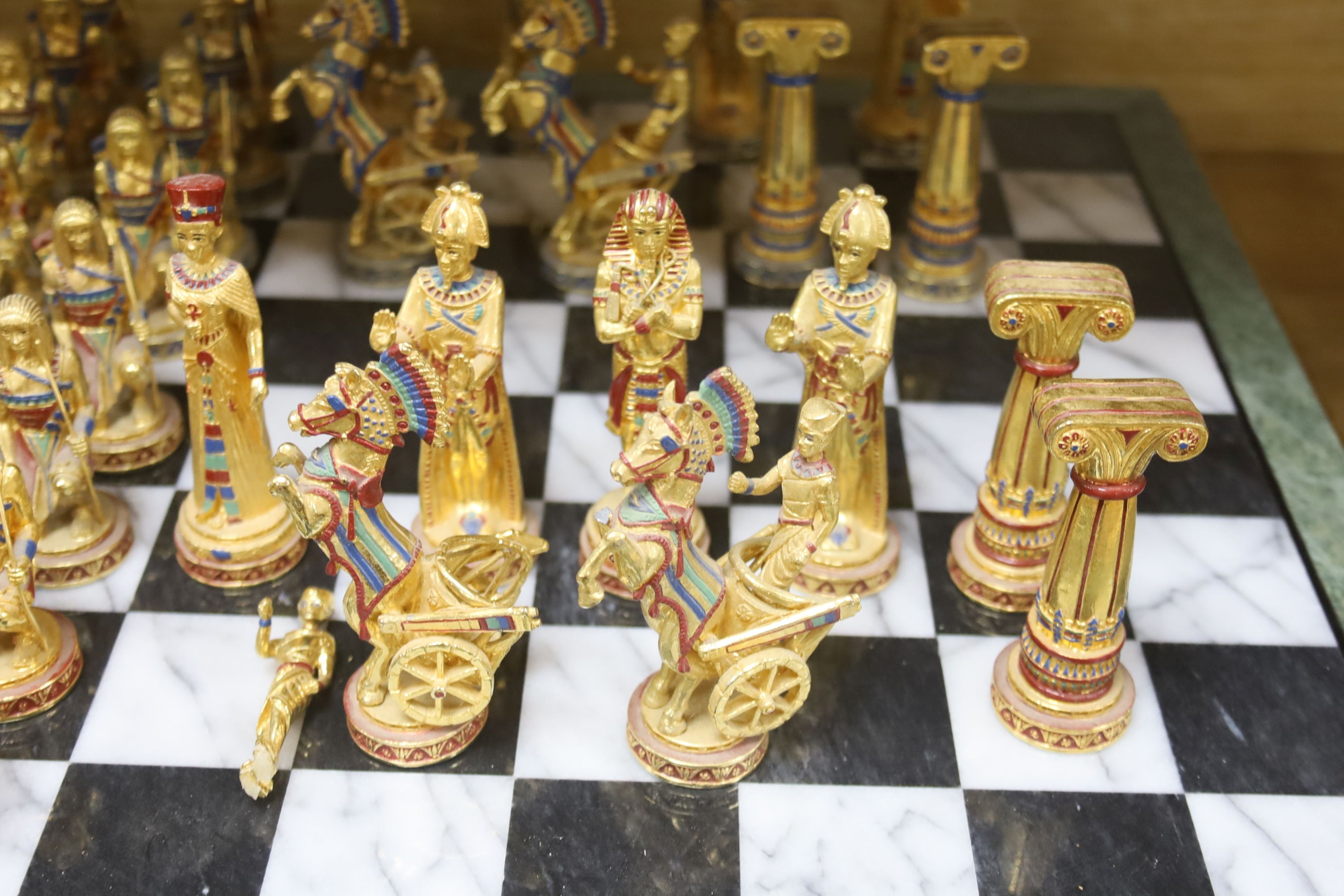 A contemporary chess board and pieces, Egyptian theme